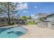 Beautiful backyard pool with an outdoor kitchen and bar area, perfect for summer gatherings at 18066 N Stonegate Rd, Maricopa, AZ 85138