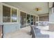 Inviting covered patio with comfortable seating, a ceiling fan, and sliding glass doors to the interior at 18066 N Stonegate Rd, Maricopa, AZ 85138
