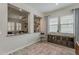 Open-concept dining room with a view of the living area and large windows at 18066 N Stonegate Rd, Maricopa, AZ 85138