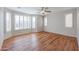 Inviting bedroom with wood floors and plantation shutters offering natural light and privacy at 18137 W Deer Creek Rd, Goodyear, AZ 85338