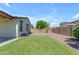 Beautifully landscaped backyard with low-maintenance turf and decorative rock at 18362 W Illini St, Goodyear, AZ 85338