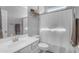 Bright bathroom with a vanity, framed mirror, toilet, and a shower featuring a shower curtain at 18362 W Illini St, Goodyear, AZ 85338