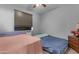 Bedroom with two beds, window AC unit, and wood dresser at 18362 W Illini St, Goodyear, AZ 85338