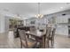 Open floor plan featuring a dining area adjacent to a living room with leather furniture at 18362 W Illini St, Goodyear, AZ 85338