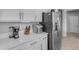 Modern kitchen area featuring stainless steel appliances, sleek countertops, and updated cabinetry at 18362 W Illini St, Goodyear, AZ 85338