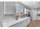 Bright kitchen with white cabinets, stainless steel appliances and ample counter space under a window at 18362 W Illini St, Goodyear, AZ 85338