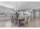 Bright kitchen and dining area featuring a large kitchen island and stainless steel appliances at 18362 W Illini St, Goodyear, AZ 85338
