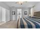 Bright main bedroom with an en suite bathroom and neutral colored walls at 18362 W Illini St, Goodyear, AZ 85338