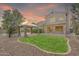 View of the home's private backyard, including a lawn, gazebo, pool, and covered patio at 1903 E Jasper Dr, Chandler, AZ 85225