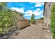 View of the backyard with gravel, privacy wall, and desert landscaping at 1903 E Jasper Dr, Chandler, AZ 85225
