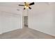 This carpeted bedroom features a ceiling fan and sliding closet door at 1903 E Jasper Dr, Chandler, AZ 85225