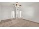 Empty primary bedroom with a ceiling fan, vaulted ceiling and neutral carpeting at 1903 E Jasper Dr, Chandler, AZ 85225