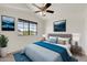 Comfortable bedroom featuring a plush bed, bedside tables, and a window offering plenty of natural light at 1903 E Jasper Dr, Chandler, AZ 85225