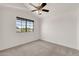 Bedroom featuring a ceiling fan and a window with a green view at 1903 E Jasper Dr, Chandler, AZ 85225