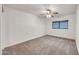 Empty bedroom with neutral carpeting and a ceiling fan at 1903 E Jasper Dr, Chandler, AZ 85225