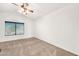 Empty primary bedroom with a vaulted ceiling, neutral carpeting and a ceiling fan at 1903 E Jasper Dr, Chandler, AZ 85225
