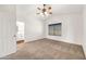 Vaulted ceiling primary bedroom with a ceiling fan, an ensuite bath and neutral carpeting at 1903 E Jasper Dr, Chandler, AZ 85225