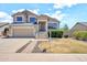 Charming two-story home with a well-maintained lawn and inviting curb appeal on a sunny day at 1903 E Jasper Dr, Chandler, AZ 85225