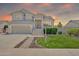 Charming two-story home with a well-manicured lawn, inviting entrance, and a two-car garage at 1903 E Jasper Dr, Chandler, AZ 85225