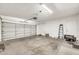Spacious two-car garage with white walls and concrete floors at 1903 E Jasper Dr, Chandler, AZ 85225