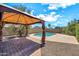 View of the backyard pool and gazebo with desert landscaping at 1903 E Jasper Dr, Chandler, AZ 85225
