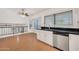 Bright kitchen featuring white cabinets, stainless appliances, granite countertops, wood flooring and a breakfast nook at 1903 E Jasper Dr, Chandler, AZ 85225
