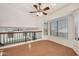 Bright living room features new laminate wood flooring, windows, and a modern ceiling fan at 1903 E Jasper Dr, Chandler, AZ 85225