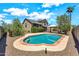 Backyard view of a refreshing pool with mature trees and shrubbery at 1903 E Jasper Dr, Chandler, AZ 85225
