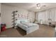 Bright bedroom features stylish decor, modern furnishings, and a comfortable bed at 20826 S Hadrian Way, Queen Creek, AZ 85142