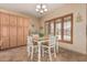 Bright dining area with wood shutters and a farmhouse table, perfect for Gathering meals at 20826 S Hadrian Way, Queen Creek, AZ 85142