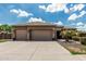 Inviting home featuring a wide driveway, manicured front yard, and a well-maintained facade at 20826 S Hadrian Way, Queen Creek, AZ 85142