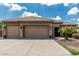 Inviting home featuring a wide driveway, manicured front yard, and a well-maintained facade at 20826 S Hadrian Way, Queen Creek, AZ 85142