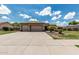 Charming single-story home with a tile roof, three-car garage, and well-maintained landscaping at 20826 S Hadrian Way, Queen Creek, AZ 85142