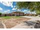 Home exterior with a wide driveway and desert landscaping at 20826 S Hadrian Way, Queen Creek, AZ 85142