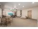 Large, carpeted recreation area features a pool table and lounge seating at 20826 S Hadrian Way, Queen Creek, AZ 85142