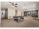 Spacious game room with pool table, wall decor, and stylish furnishings at 20826 S Hadrian Way, Queen Creek, AZ 85142