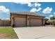 Home with a wide driveway leading to a three-car garage, complimented by well-maintained lawn at 20826 S Hadrian Way, Queen Creek, AZ 85142
