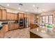 Spacious kitchen with granite countertops, stainless steel appliances, and ample cabinet space at 20826 S Hadrian Way, Queen Creek, AZ 85142