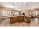 Spacious open kitchen with a large island featuring granite counters and stainless steel appliances at 20826 S Hadrian Way, Queen Creek, AZ 85142