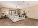 Bright living room with a plush sectional sofa, modern decor, and natural light at 20826 S Hadrian Way, Queen Creek, AZ 85142