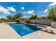 Backyard with a large sparkling pool, diving board, and plenty of room for outdoor activities at 20826 S Hadrian Way, Queen Creek, AZ 85142