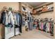 Spacious walk-in closet with ample shelving and hanging space for clothes and accessories at 20826 S Hadrian Way, Queen Creek, AZ 85142