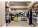 Walk-in closet features ample shelving and space for organizing clothes and personal items at 20826 S Hadrian Way, Queen Creek, AZ 85142