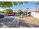 Expansive backyard showcasing desert landscaping and a charming patio area with mature shade trees at 2214 N 7Th Ave, Phoenix, AZ 85007