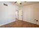 Bedroom featuring wood-look tile floors, a ceiling fan, and white walls at 2214 N 7Th Ave, Phoenix, AZ 85007
