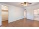 Bright bedroom boasts wood-look tile floors, and includes both a large closet and an ensuite bathroom at 2214 N 7Th Ave, Phoenix, AZ 85007