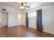 Bedroom featuring wood-look tile floors and ensuite bathroom with ample natural light at 2214 N 7Th Ave, Phoenix, AZ 85007