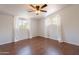 Bedroom with wood-look tile floors, ceiling fan, and lots of natural light from windows at 2214 N 7Th Ave, Phoenix, AZ 85007