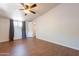Bedroom features wood-look tile floors, a ceiling fan, and great natural light at 2214 N 7Th Ave, Phoenix, AZ 85007