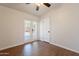 Bright bedroom with French doors and ceiling fan, complemented by wood-look flooring at 2214 N 7Th Ave, Phoenix, AZ 85007